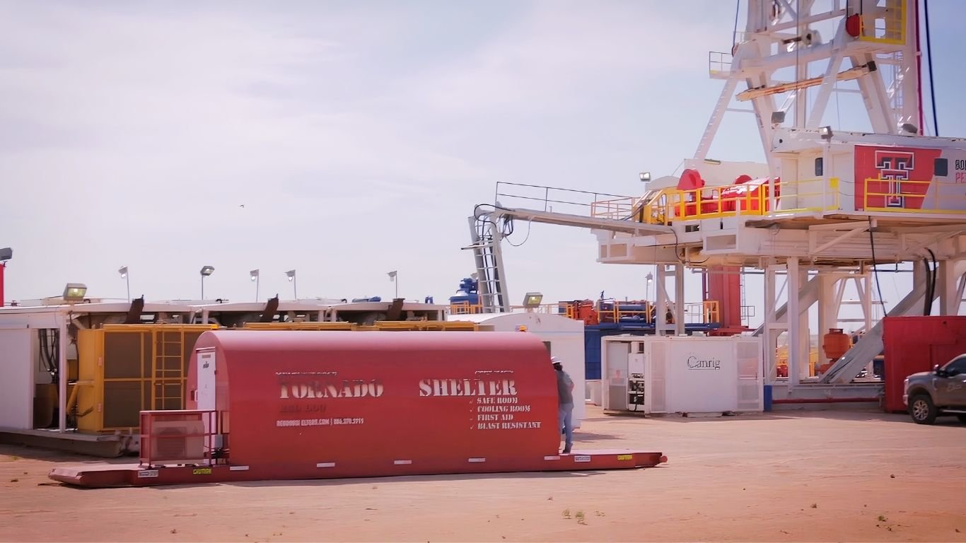 A mobile safety trailer parked at a drilling site for Oil Rig Storm Shelters.
